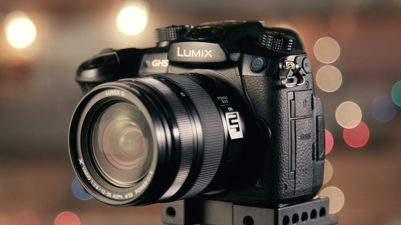 mirrorless and DSLR cameras - bokeh photography of black Lumix DSLR camera