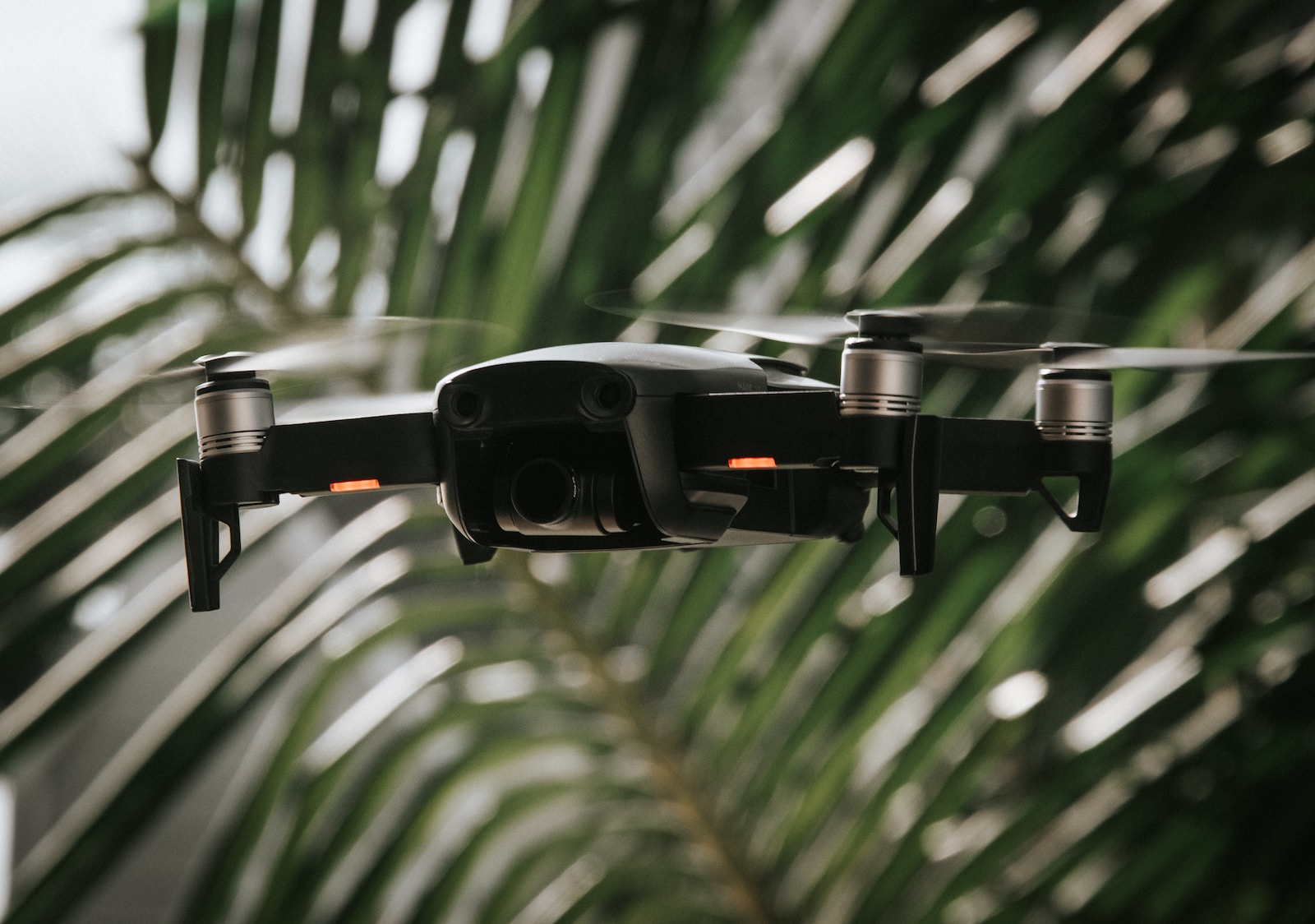 Aerial Videography black and silver drone in tilt shift lens