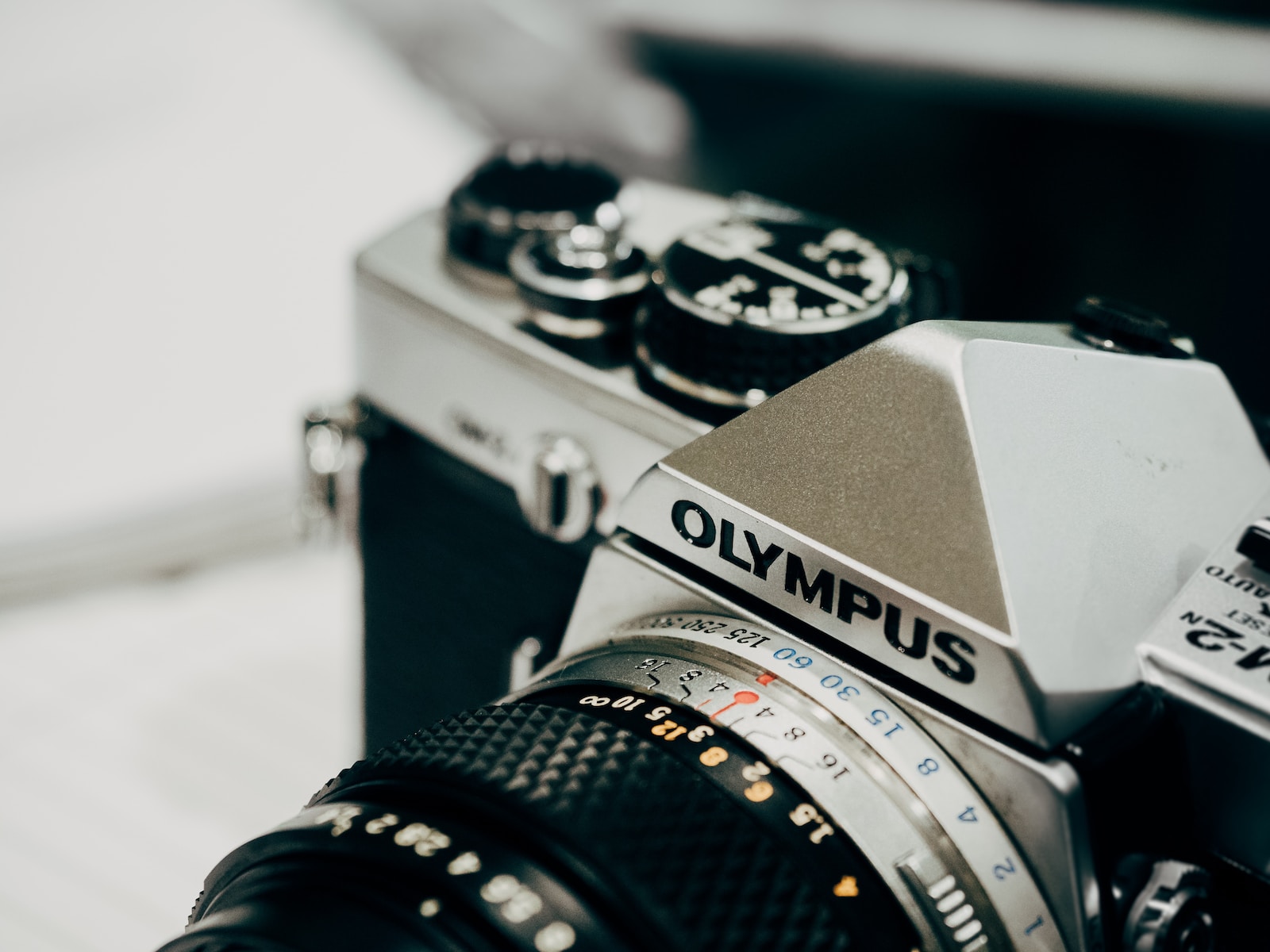 SLR Film Camera closeup photography of black and gray Olympus camera